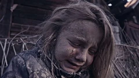 A hungry homeless child cries. War. Refugees Stock Footage