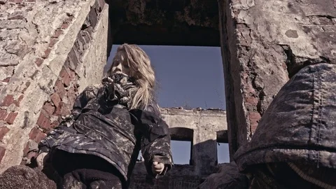 Hungry homeless child near the ruins. Refugees Stock Footage