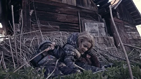 Hungry homeless child near the ruins. Refugees Stock Footage