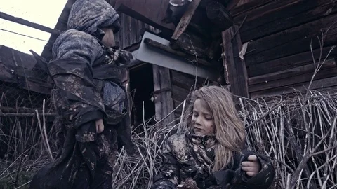 Hungry homeless child near the ruins. Refugees Stock Footage