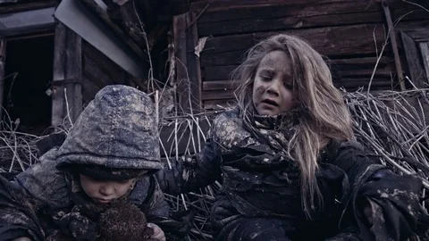 Hungry homeless child near the ruins. Refugees Stock Footage