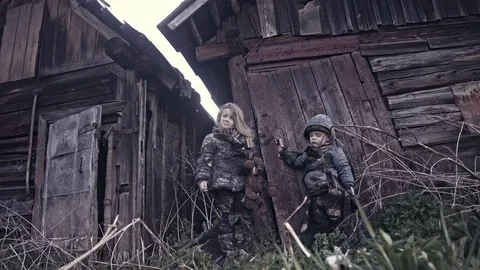 Hungry homeless child near the ruins. Refugees Stock Footage