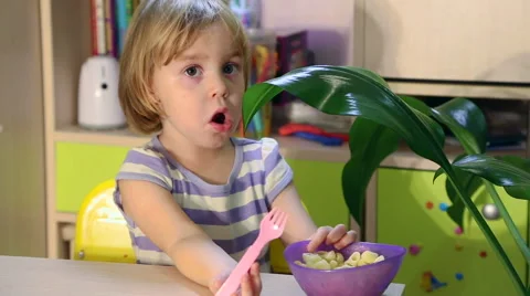 Hungry little kid eats. Stock Footage 68119261