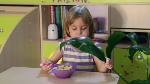 Hungry little kid eats. Video stock 68119375