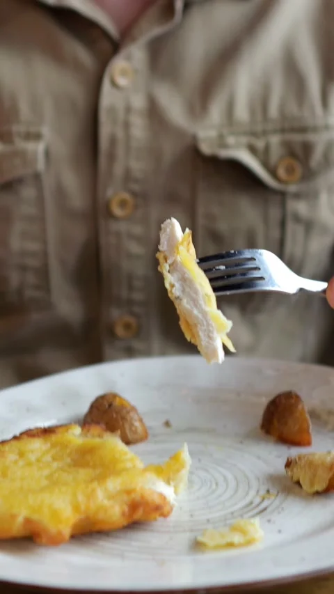 Hungry Man Cuts Fried Fish Fillet With Knife And Fork Before Tasting Lunch Vidéo 347189563