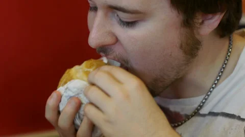 Hungry Young Man Eats Large Burger Stock Footage 39840312