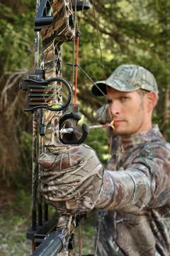 Hunter aiming compound bow Stock Photos