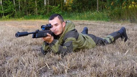 Hunter aiming a gun at wild animals 스톡 동영상 78729098