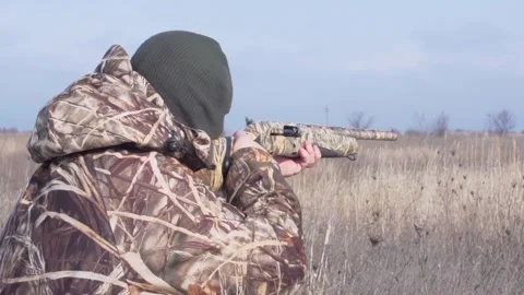 Hunter Aiming Shotgun in the Field Stock Footage 303070701
