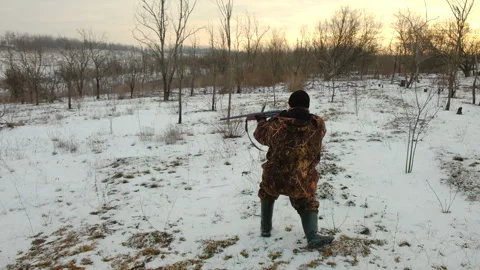 The hunter aims his gun and looks out for the victim 스톡 동영상 101214736