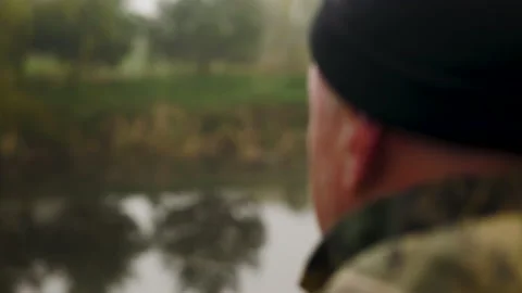 Hunter aims rifle ahead of himself Video stock 196627368