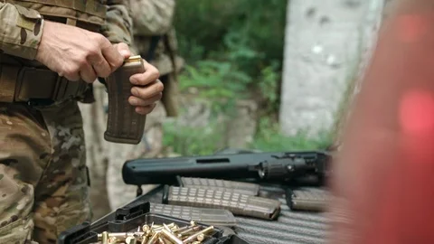A hunter charges firearms from a rifle. Video stock 108422425