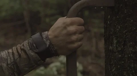 Hunter climbing a tree stand Stock-Footage 53644320