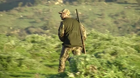 Hunter close up walk on the hill Stock-Footage 58876001
