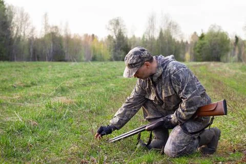 The hunter is considering the traces Stock Photos