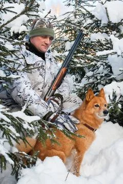 Hunter with dog during the rest Stock Photos