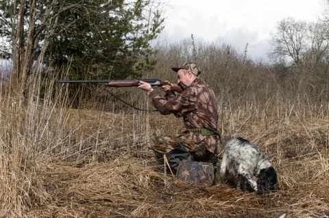 Hunter with a dog Stock Photos