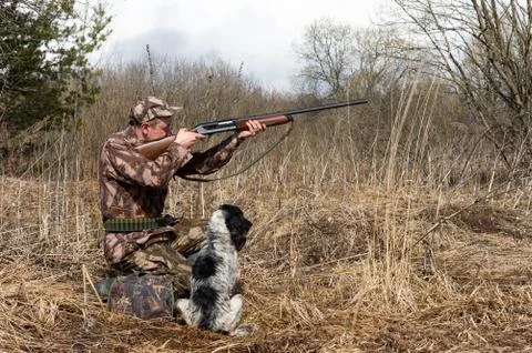 Hunter with a dog Stock Photos