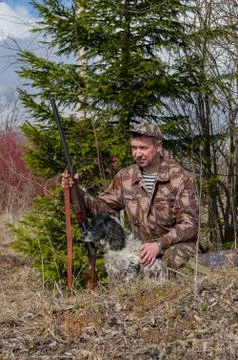 Hunter with a dog Stock Photos