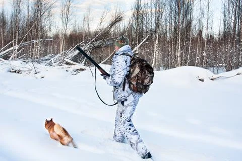 Hunter with dog in winter Stock Photos
