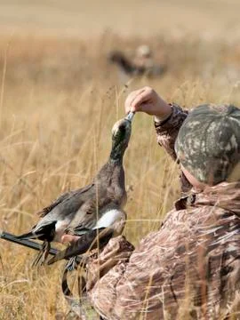 Hunter with a duck Stock Photos