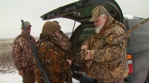 Hunter giving shotgun shells Stock Footage 54592077