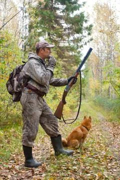 Hunter with a grouse call Stock Photos