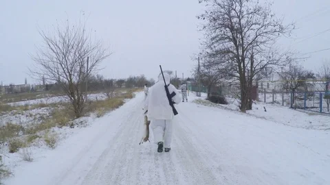 Hunter has in hand the stricken rabbit. Stock Footage 83485160