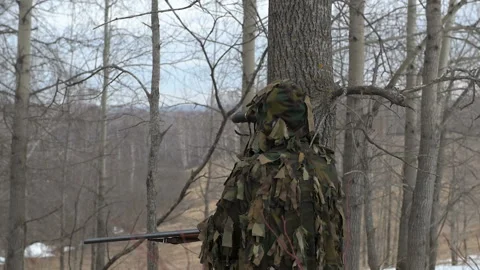 The hunter hides in the forest. Stock Footage 106715889
