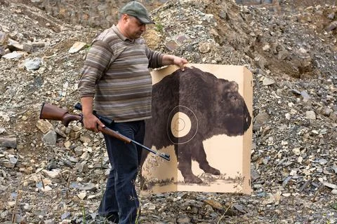 Hunter holding shooting target Stock Photos