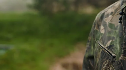 The hunter holds a weapon in his hand and reload it Stock Footage 196628696