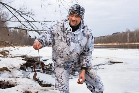 Hunter with leghold trap in winter Stock Photos
