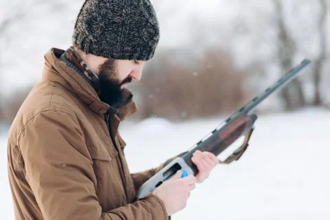 Hunter loading the gun Stock Photos