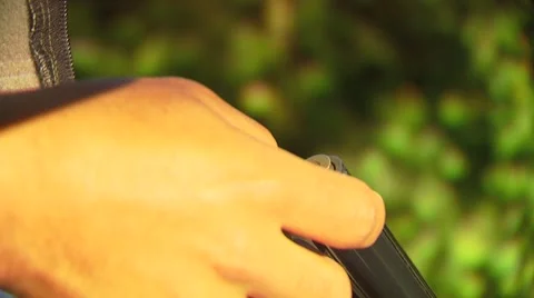 Hunter loading shells in shotgun Stock Footage 54591652