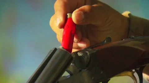 Hunter loading shells in shotgun Stock Footage 54591671