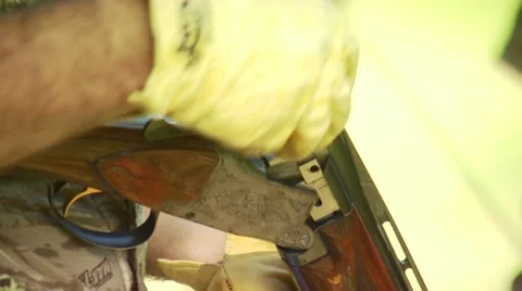 Hunter loading shells in shotgun Stock Footage 54591709