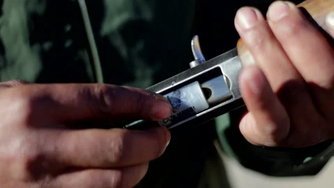 Hunter loading a shotgun Stock Footage 91335480