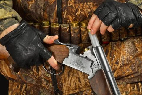 Hunter makes charging shotgun Stock Photos