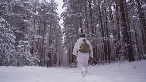 Hunter man with gun walking through the forest during the hunting season. Stock Footage 151991690