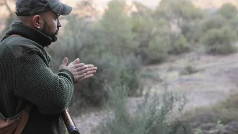 Hunter man searching for prey while hunting in nature. Video stock 237111843