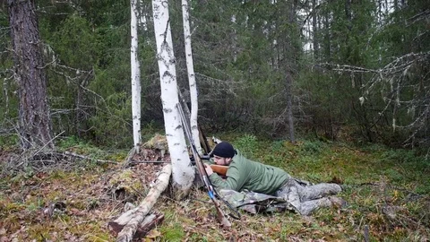 Hunter man shoots from a gun Stock Footage 70775085
