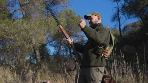 Hunter man smiling and celebrating success hunt outdoors. Video stock 237124729