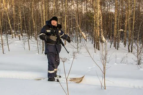 Hunter points to traces in the forest Stock Photos
