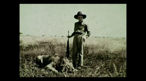 Hunter posing with lion kill, Tanzania 1937 動画素材 27154980