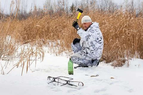 Hunter preparing a place for trap Stock Photos