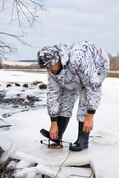 Hunter putting a leghold trap Stock Photos