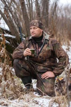 Hunter resting during the winter hunt Stock Photos
