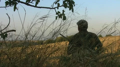 Hunter seated under the tree 動画素材 54737631