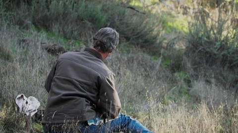 Hunter Setting Up Game Camera on Post Near Popular Wildlife Area Stock Footage 266803053