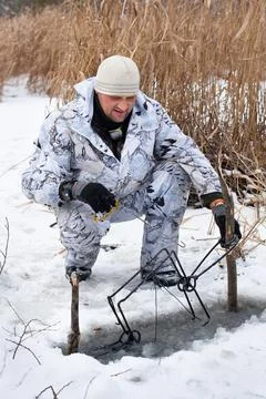 Hunter setting a trap Stock Photos